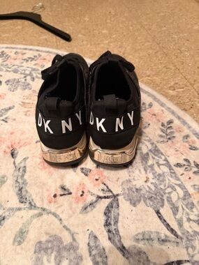 DKNY Black Slip-On Sneakers with Gold Heel Accent